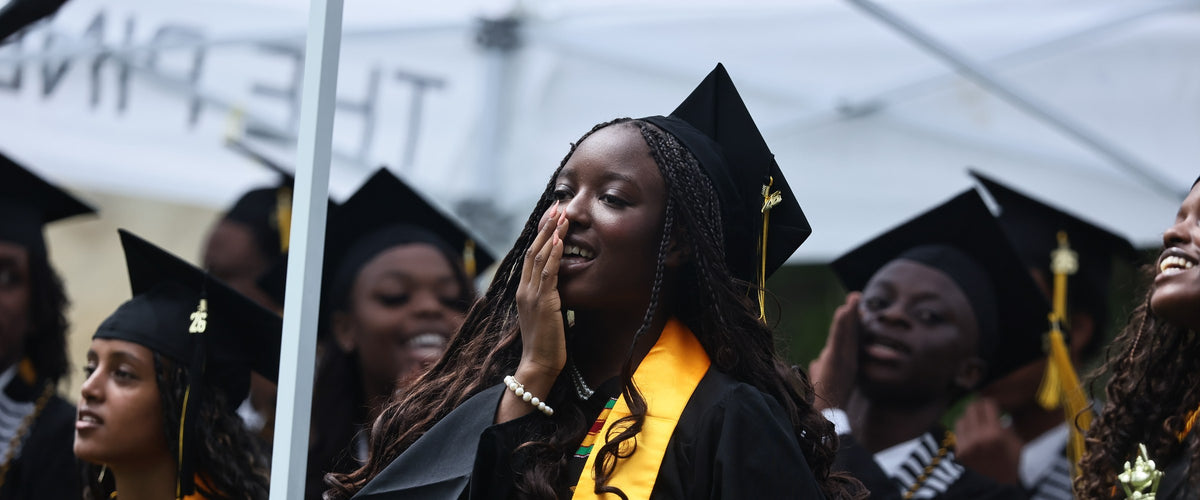 Piney Woods School graduates in black gowns and gold stoles